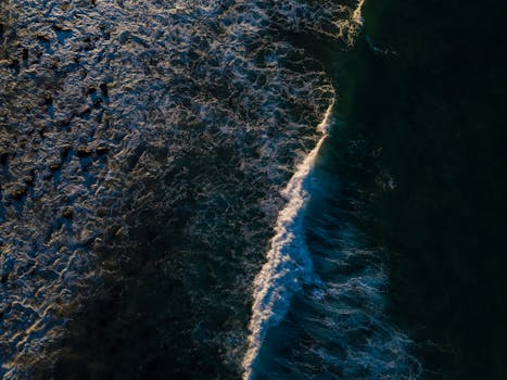 Stunning aerial coastline view at Burleigh Heads, capturing ocean waves and textures.