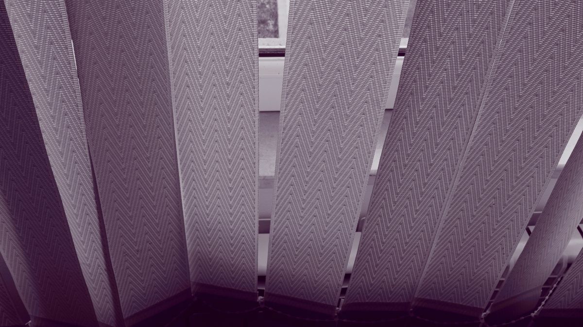 Vertical blinds installed in a bathroom