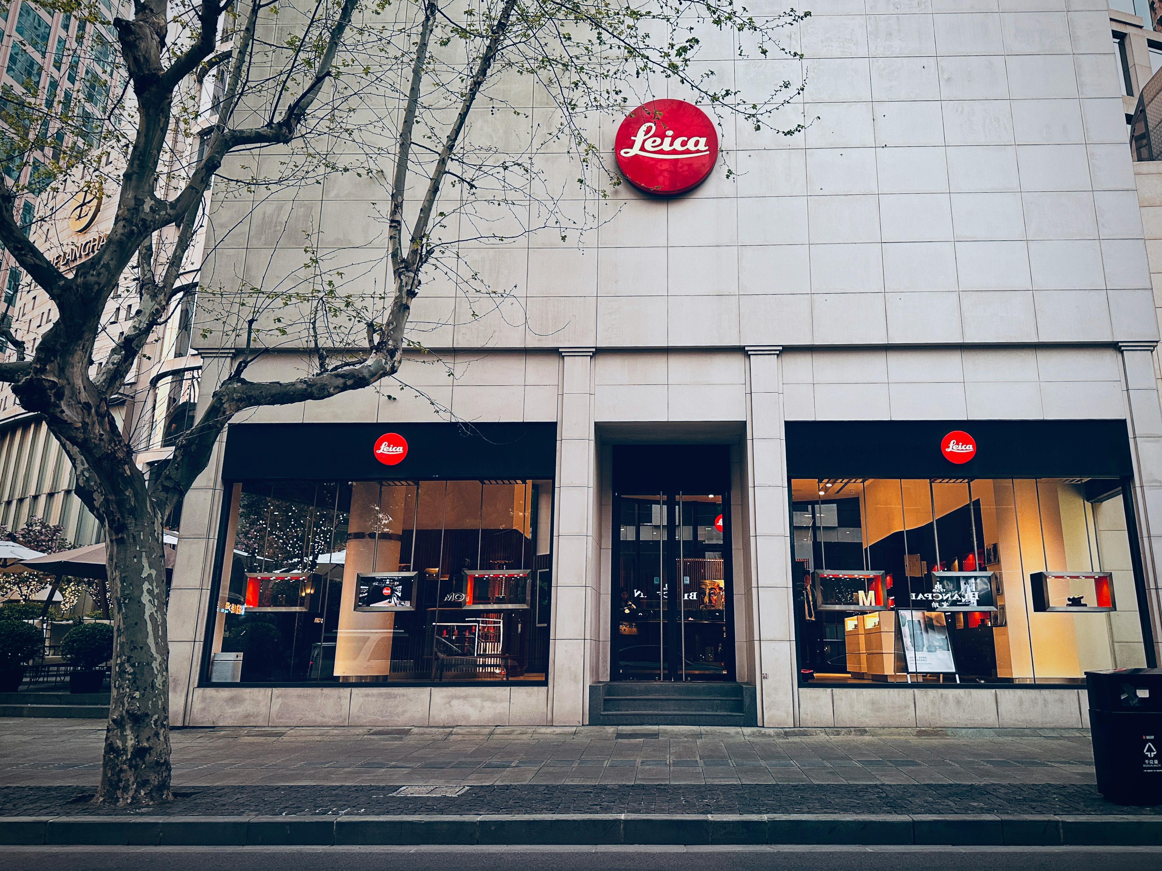 Business owner standing in front of modern retail storefront with efficient layout