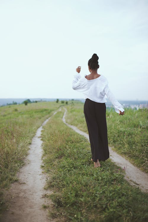 Free Photo of Woman Walking On Grass Stock Photo