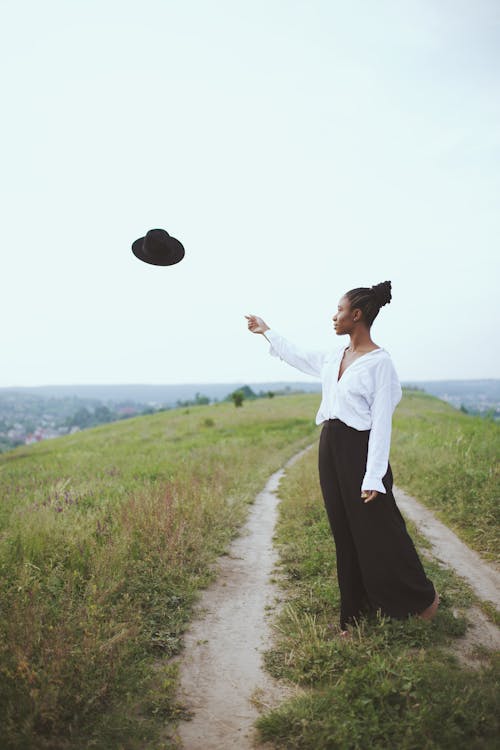 Free Photo of Woman Throwing Her Hat Stock Photo