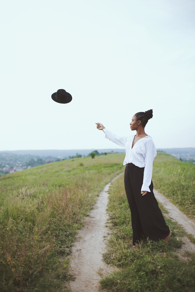 Photo Of Woman Throwing Her Hat