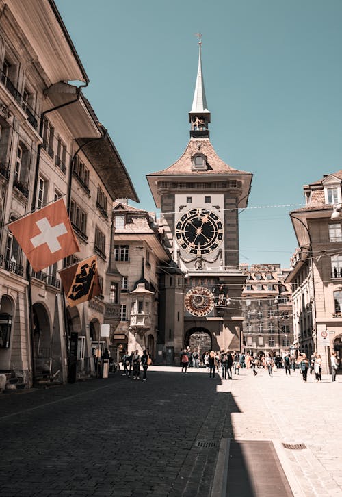 Photo of People Near Clock Tower During Daytime