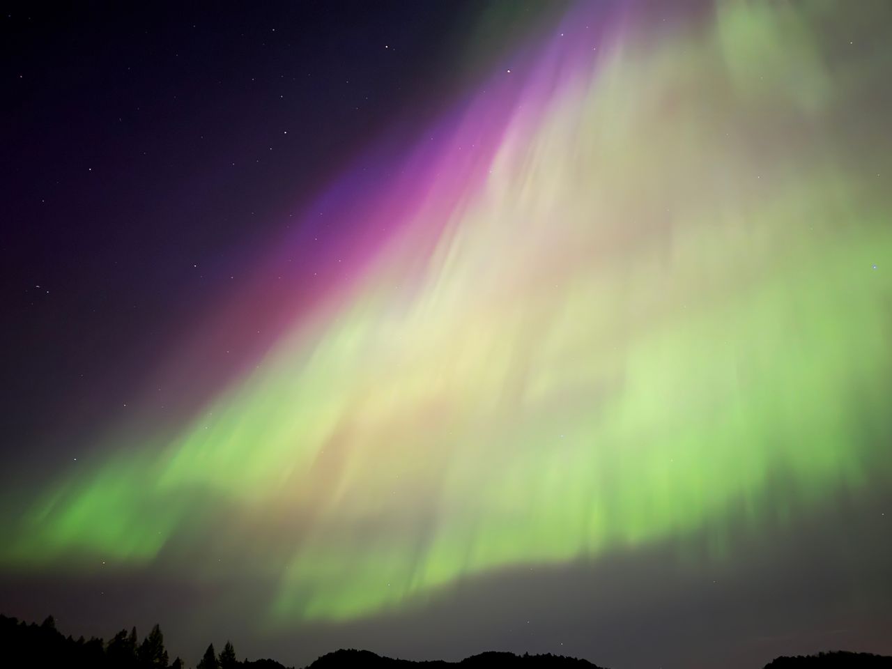 capture the surreal beauty of the aurora borealis with vivid green and