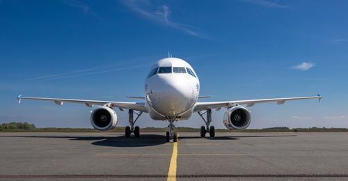 Free A frontal view of a commercial airplane on an airport runway in Sylt, Germany. Stock Photo