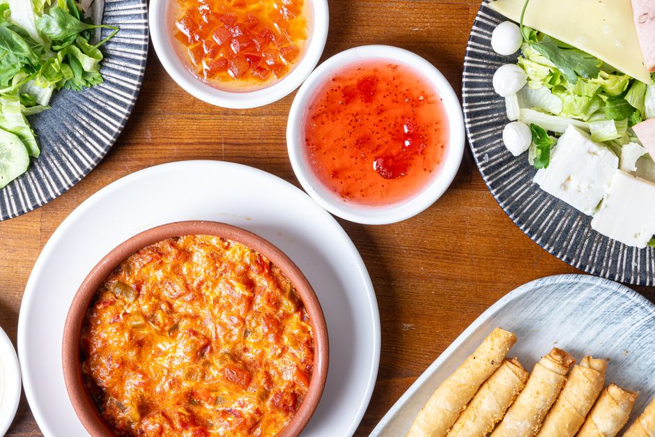 Photo by Emine Gizem on Pexels A vibrant spread of appetizers including cheese, salad, and dip. Perfect for gastronomy lovers. - Photo by Emine Gizem on Pexels