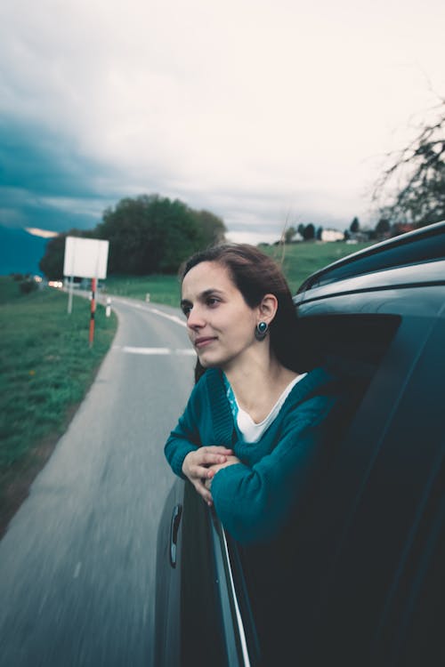 Free Woman Sitting Inside Vehicle Stock Photo