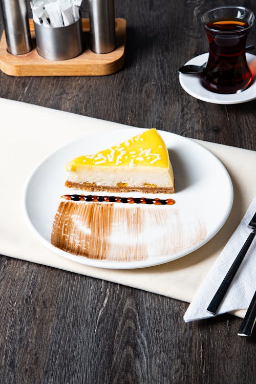 A slice of cheesecake on a plate with a fork