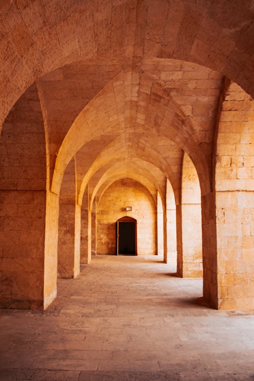 An arched tunnel with a door in the middle