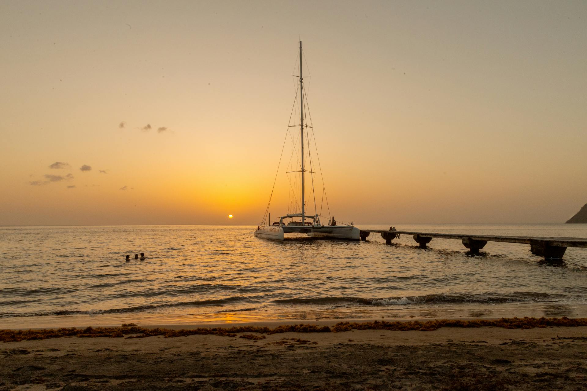 Yacht Moored on Sea Shore at Sunset