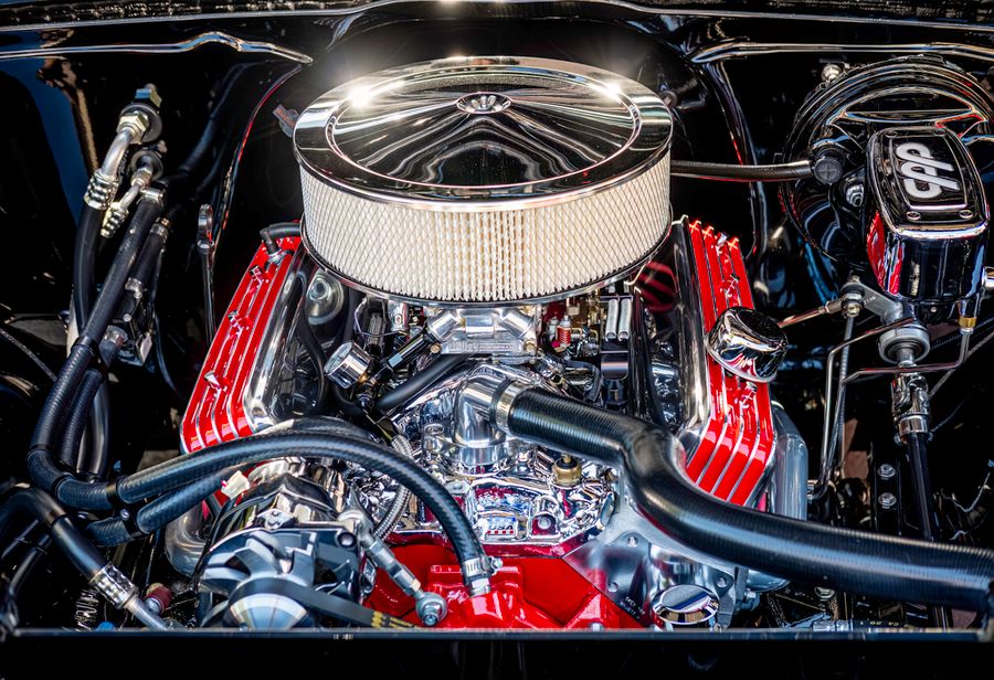 Polished modern high-performance car engine with visible piping