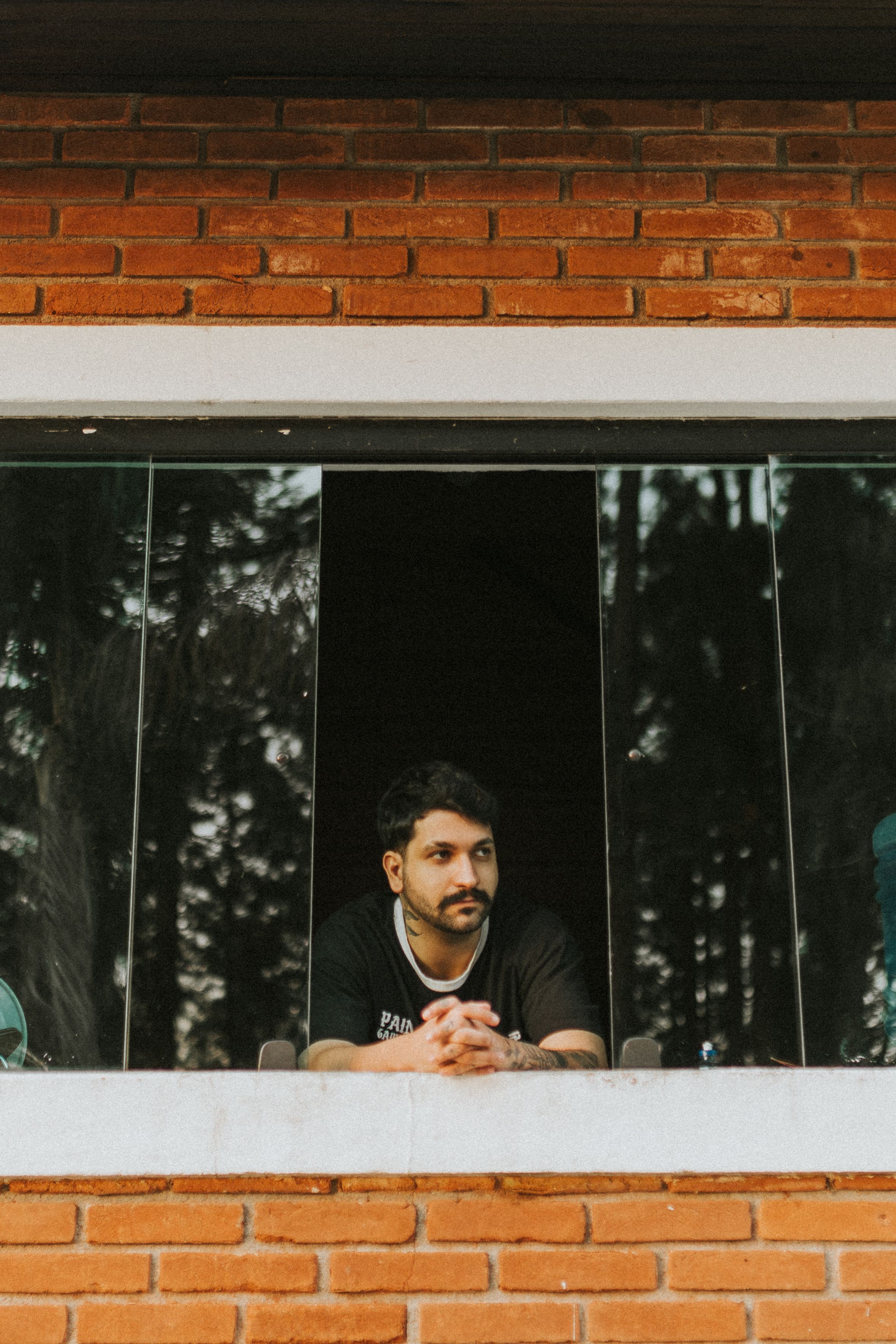 Man with Mustache in Opened Window · Free Stock Photo