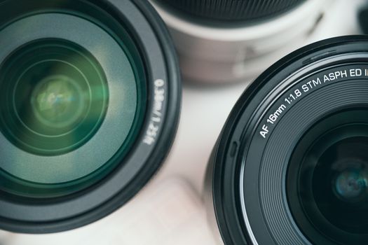 Detailed close-up shot of camera lenses showcasing optical equipment for photography.