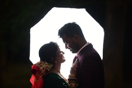 A couple in the dark under an umbrella