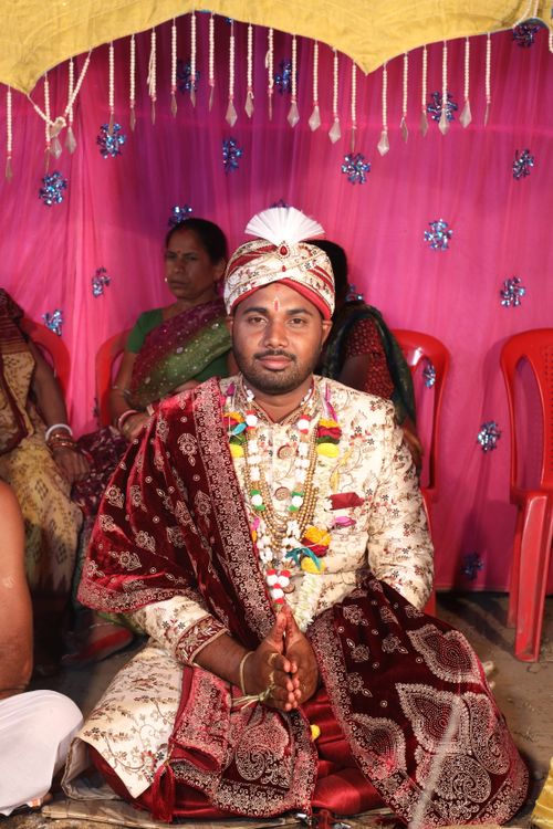 Free A groom in traditional attire during a South Asian wedding ceremony. Stock Photo
