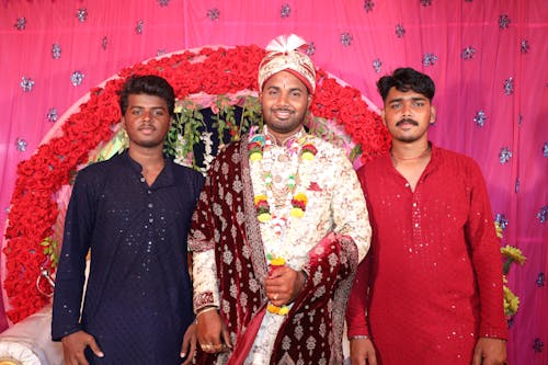 Three men in traditional attire standing next to each other