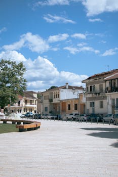Picturesque view of a town street in Ioannina, Greece with traditional architecture on a sunny day.