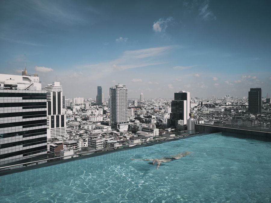 Rooftop pool overlooking high-rise buildings, Oniru Lagos style