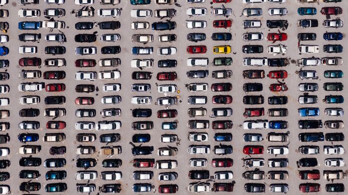 Semi-truck fleet on highway representing long-haul trucking