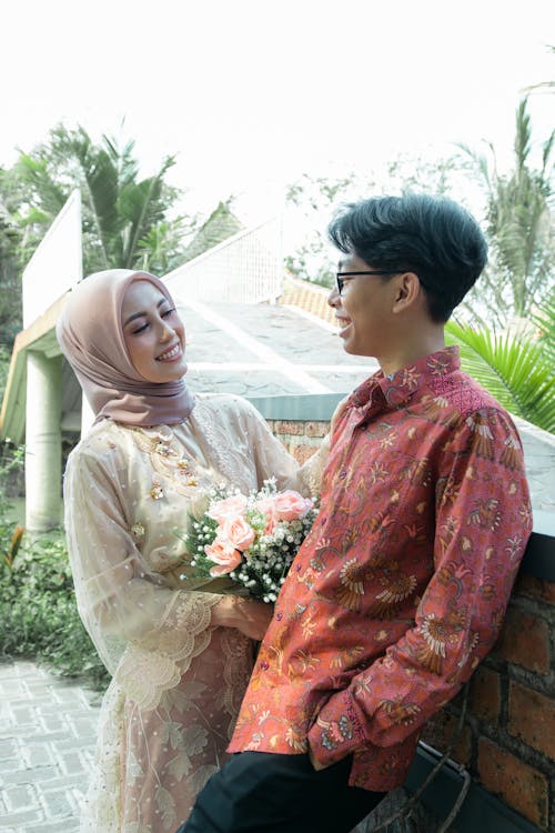 A man and woman in traditional clothing standing next to each other