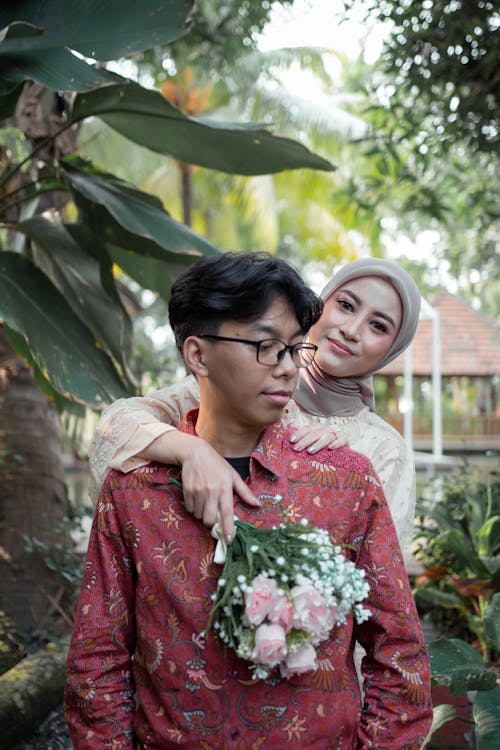 A man and woman are posing for a photo