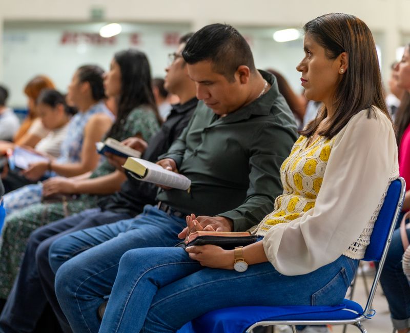 A community gathering for prayer and Bible study