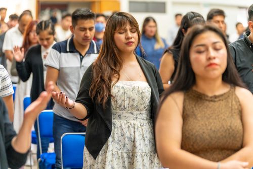 Free A multicultural group praying inside a church in Mexico City, CDMX, Mexico. Stock Photo