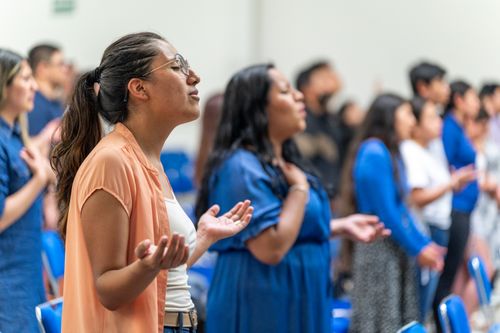 Free A congregation of diverse adults engaged in prayer during a church service in Ciudad de México. Stock Photo