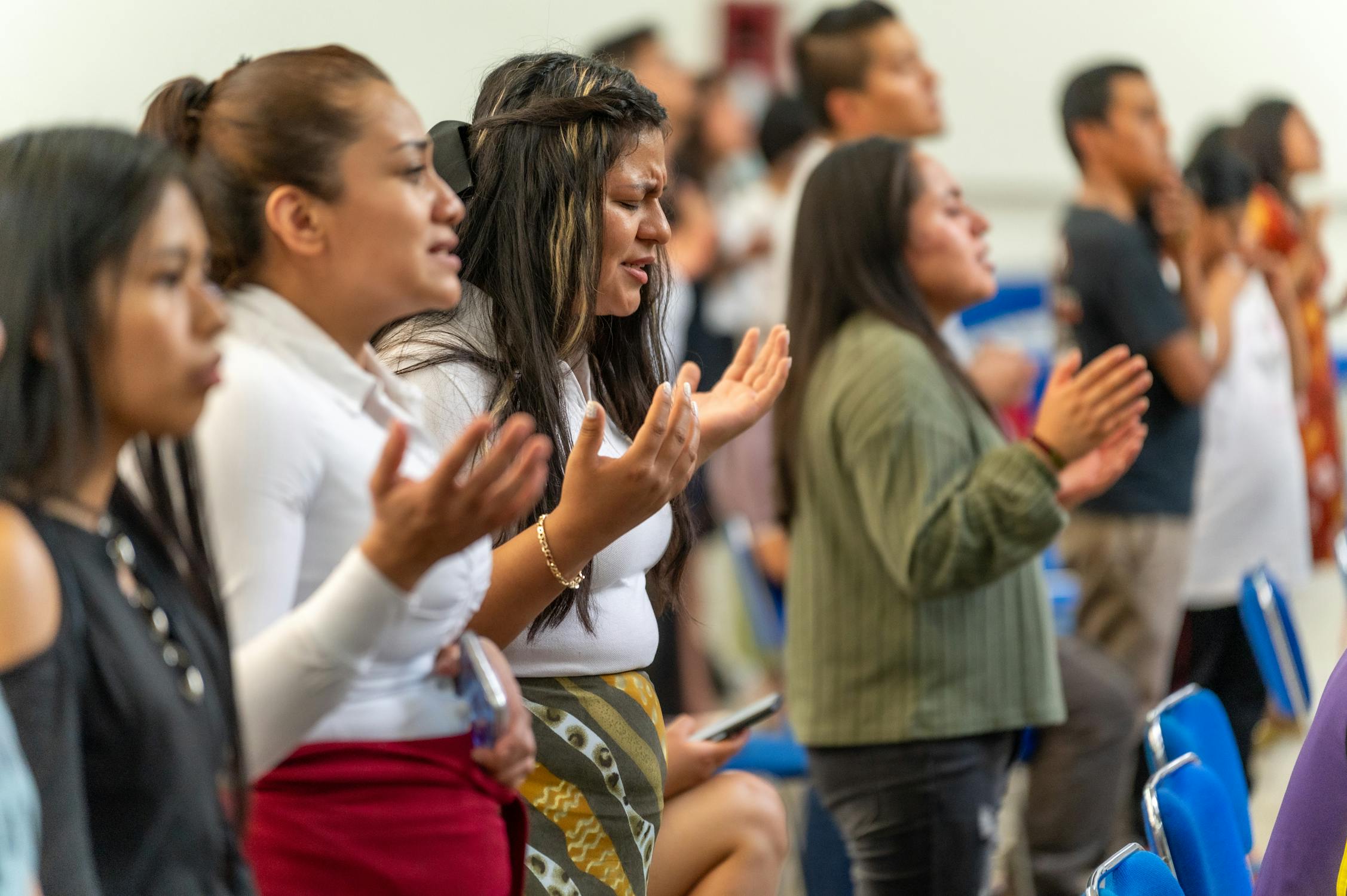 Congregation Praying with Her Eyes Closed · Free Stock Photo