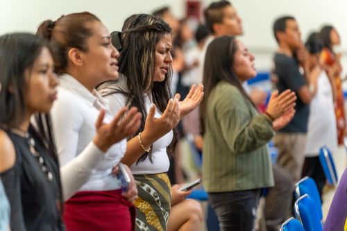 Free Young Hispanic women engaged in prayer inside a Ciudad de México church. Stock Photo