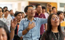 Man in Blue Shirt Singing in Church in Mexico