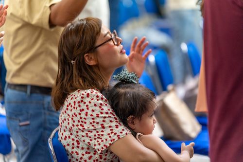 Free A woman and her child participate in a religious service in Mexico City. Stock Photo