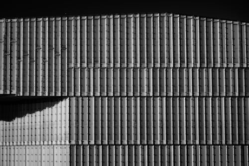 Black and white photograph of a building with a lot of metal bars