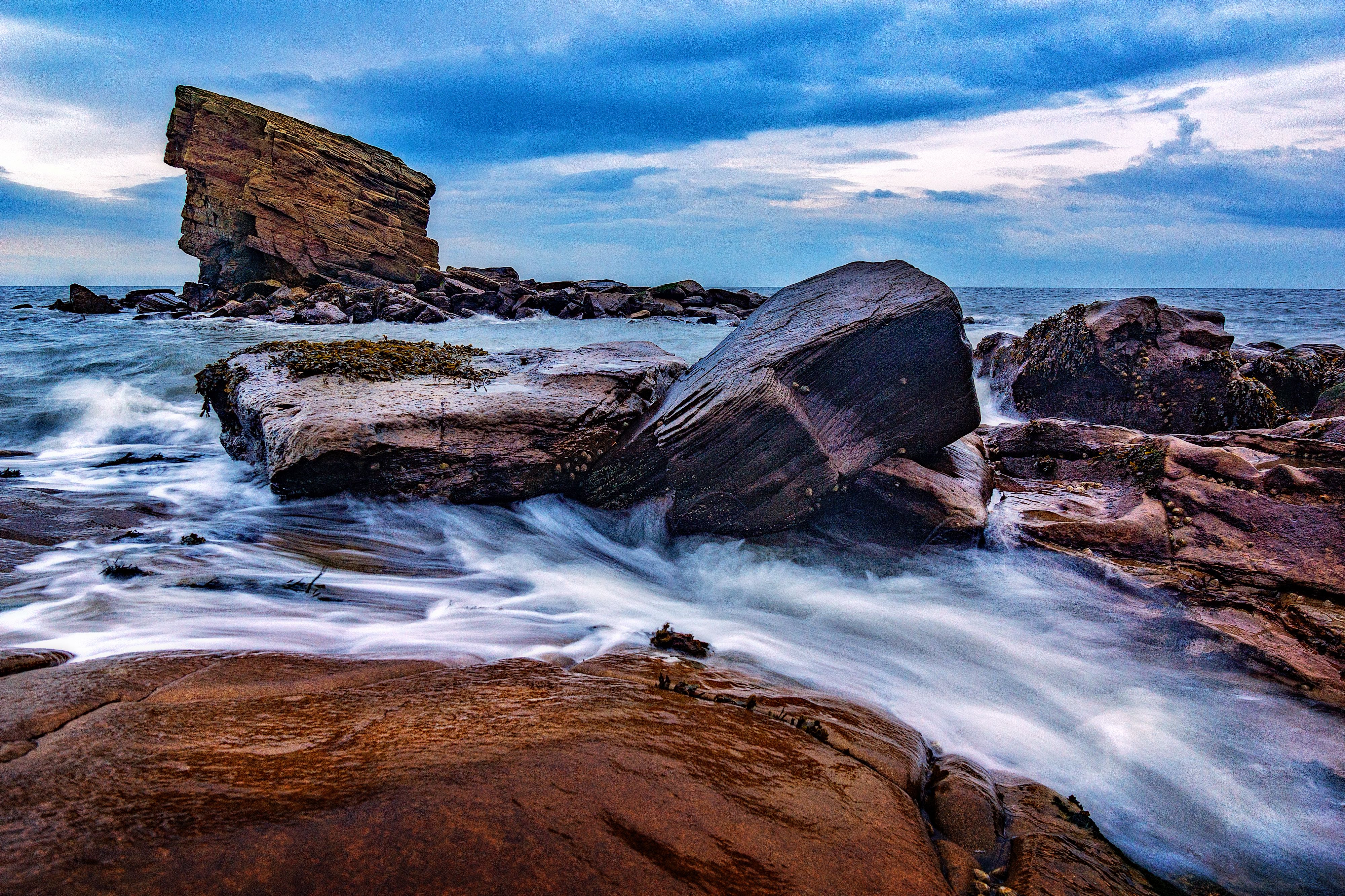 Rocks on the Beach at Sunset, Long Exposure · Free Stock Photo