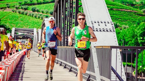 Men running on a road