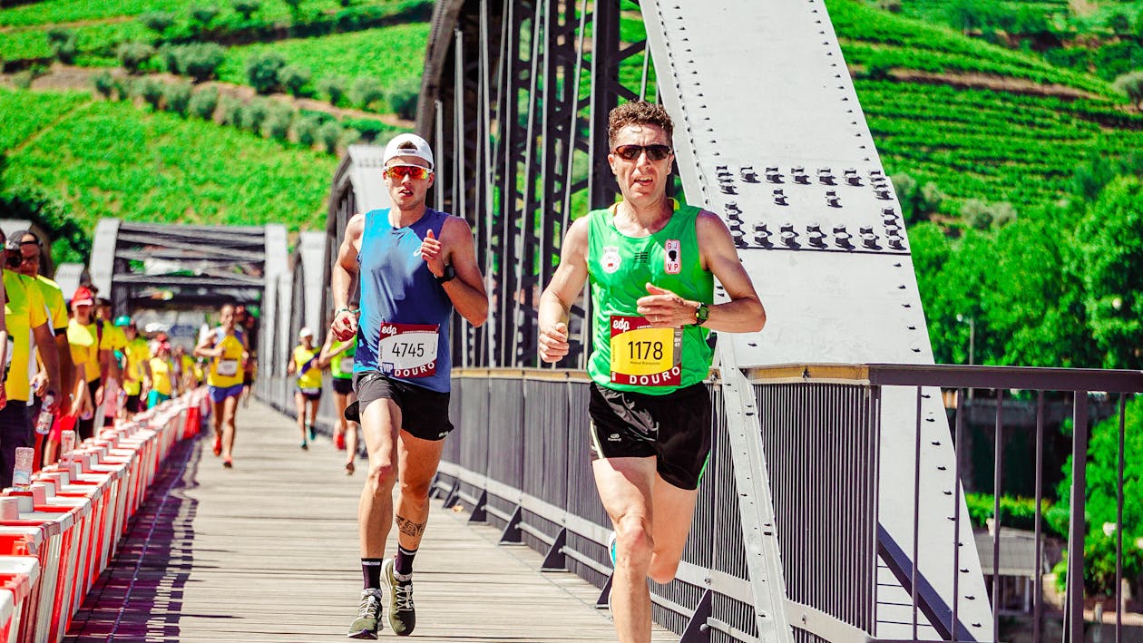 Men running on a road