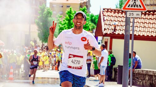 Man Running Near Signage