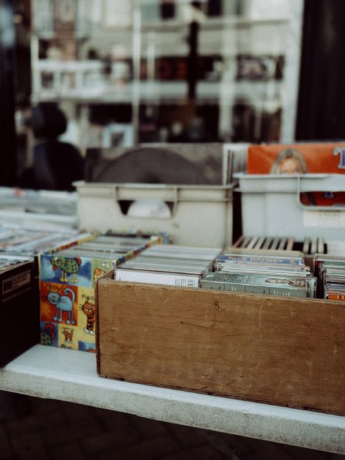 Free A collection of vinyl records on display at an outdoor market. Stock Photo