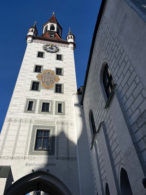 Free Gothic clock tower of Munich's Old Town Hall under clear blue sky. Stock Photo