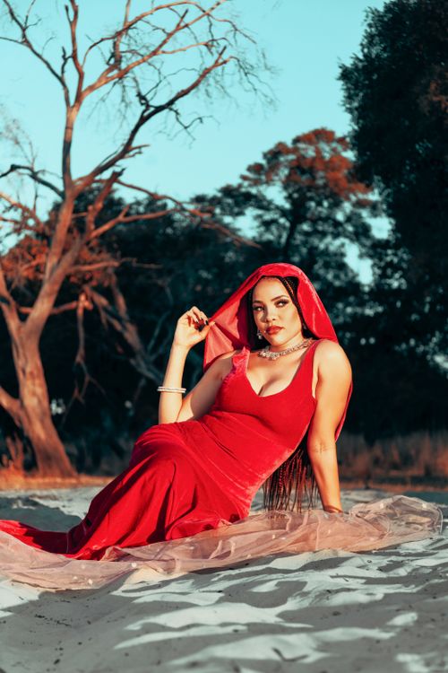 Woman Sitting in Red Dress and Veil · Free Stock Photo