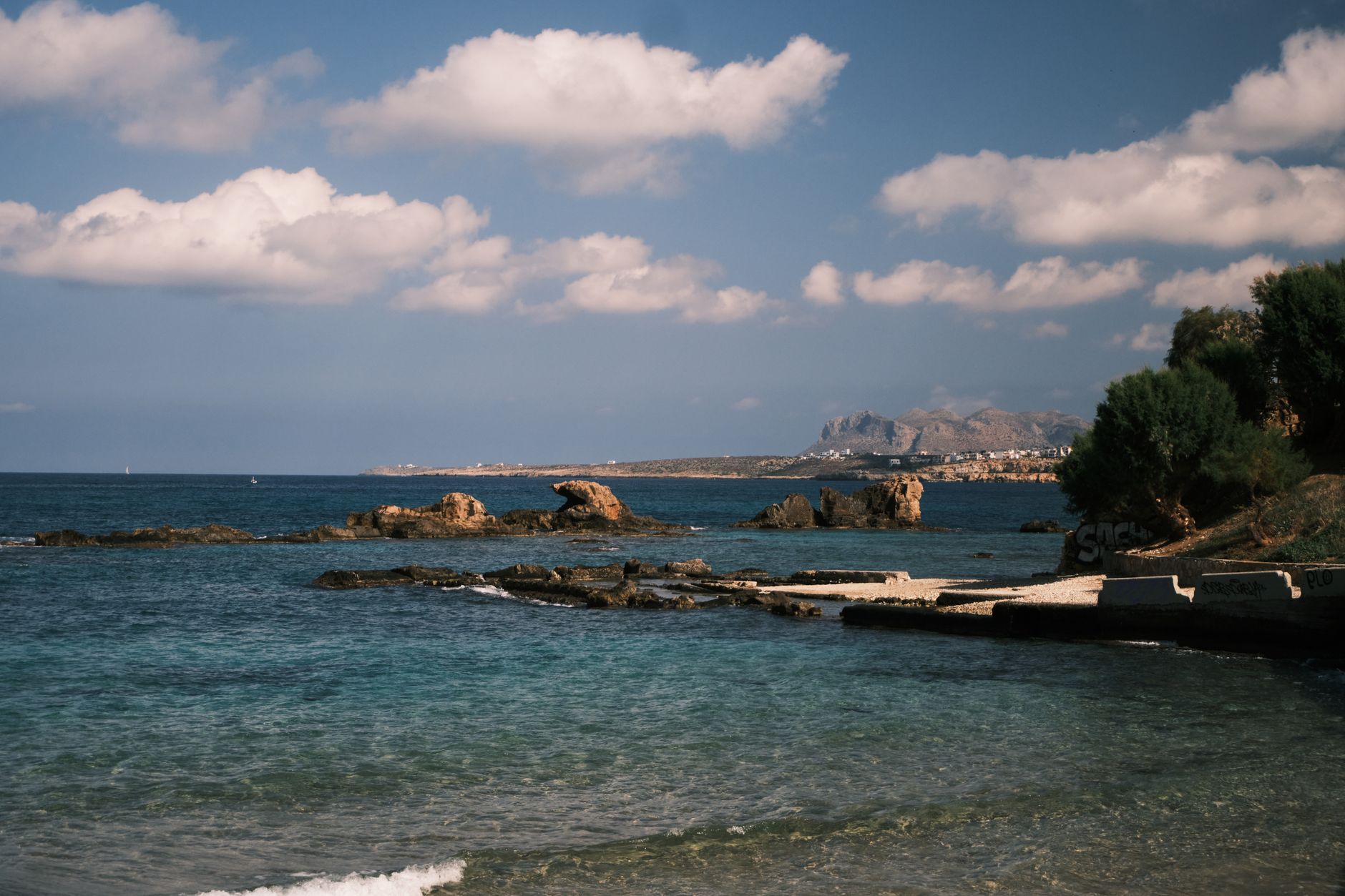 Stunning view of the rocky shoreline and blue sea in Crete, Greece.
