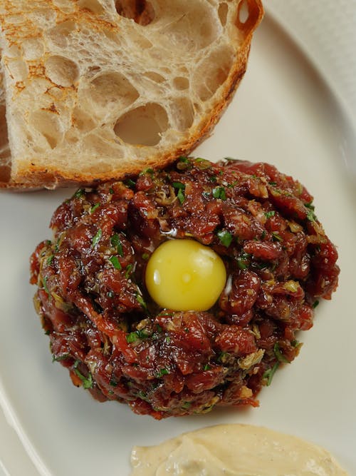 Close-up of a Steak Tartare and Bread on a Plate 