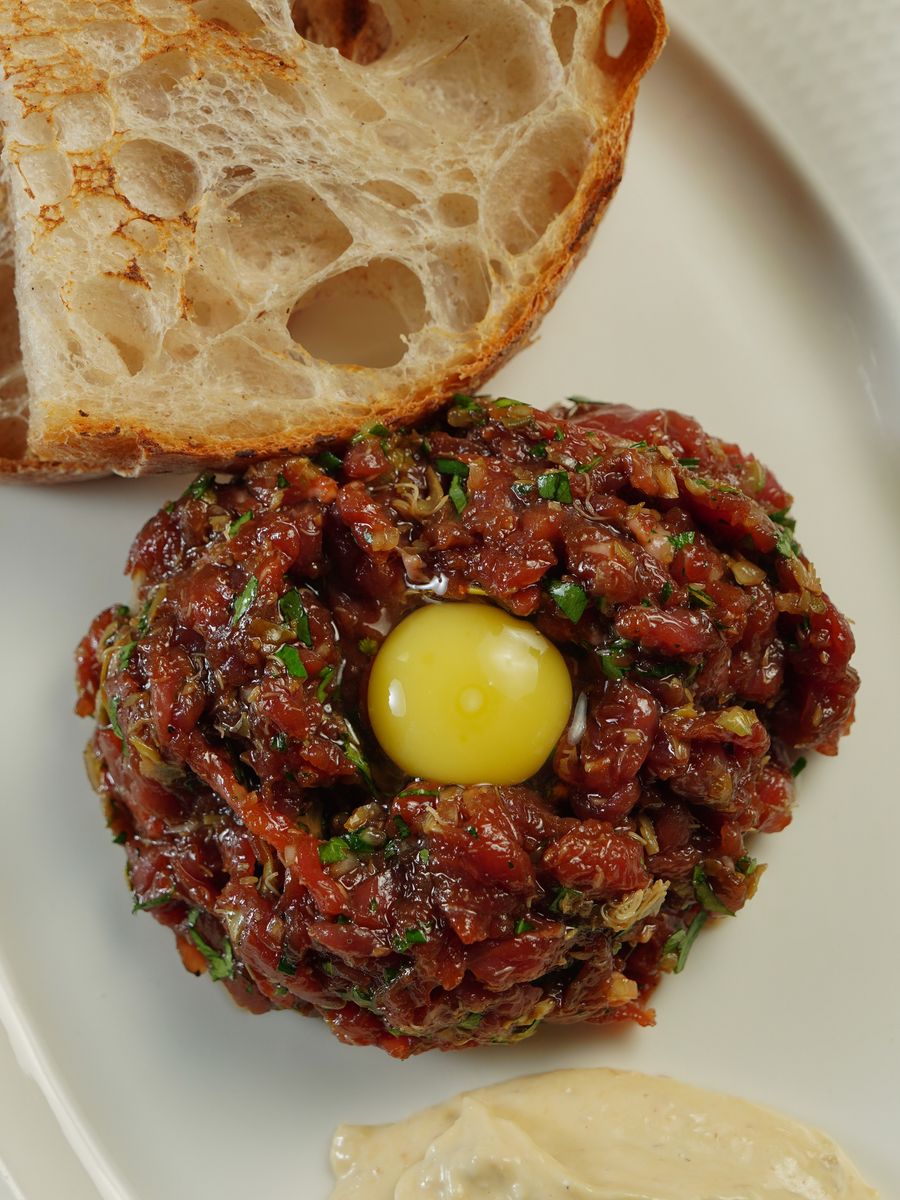 Steak tartare with egg yolk and grilled sourdough