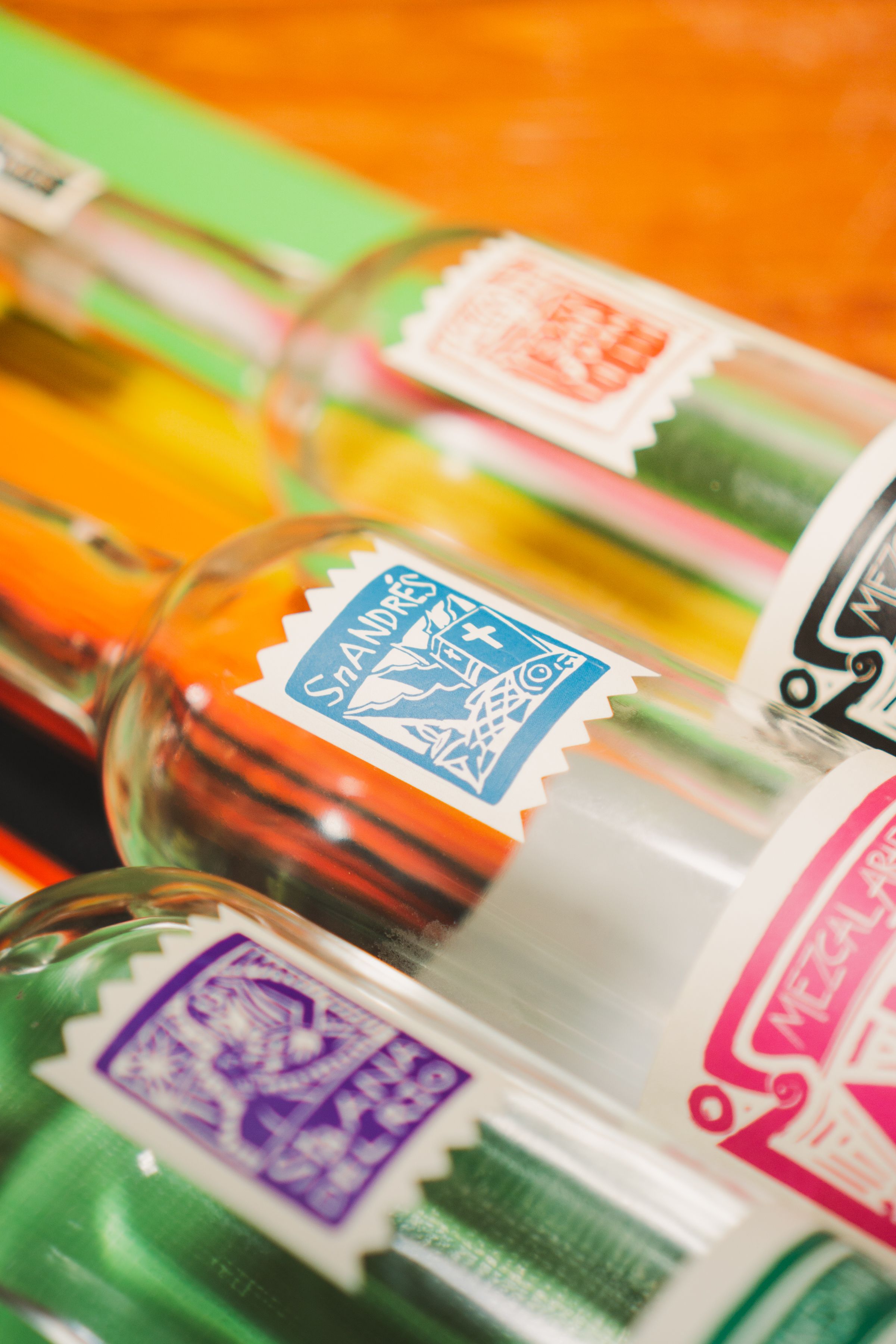 Close-up of three mezcal bottles for sale in a Puerto Escondido shop