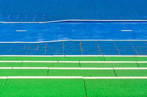 A blue and white track with green lines