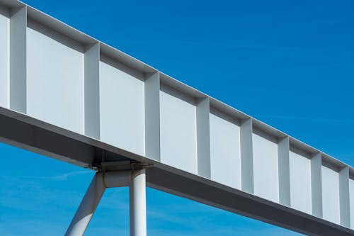 A metal bridge with a blue sky in the background