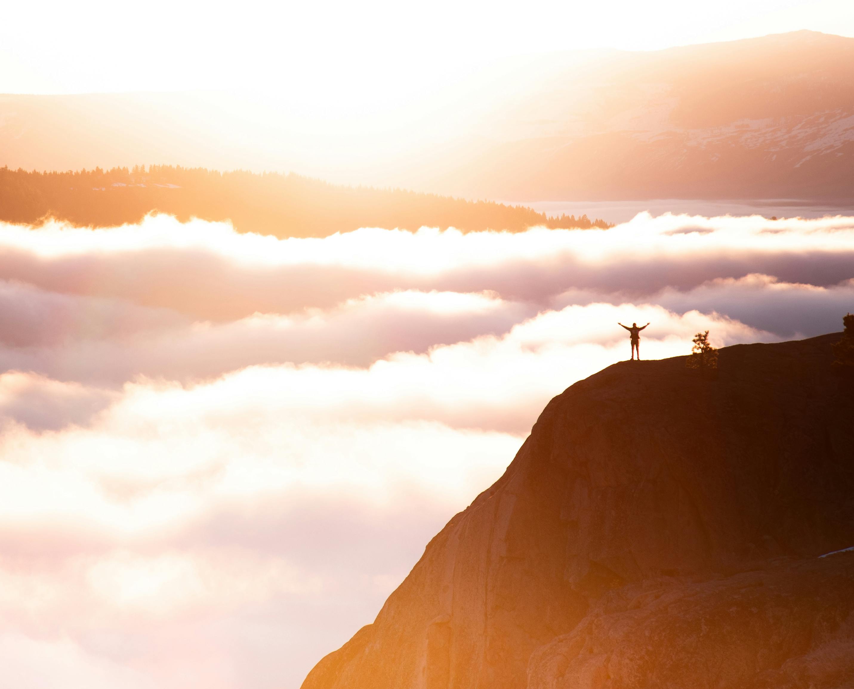 photo of a person standing in mountain