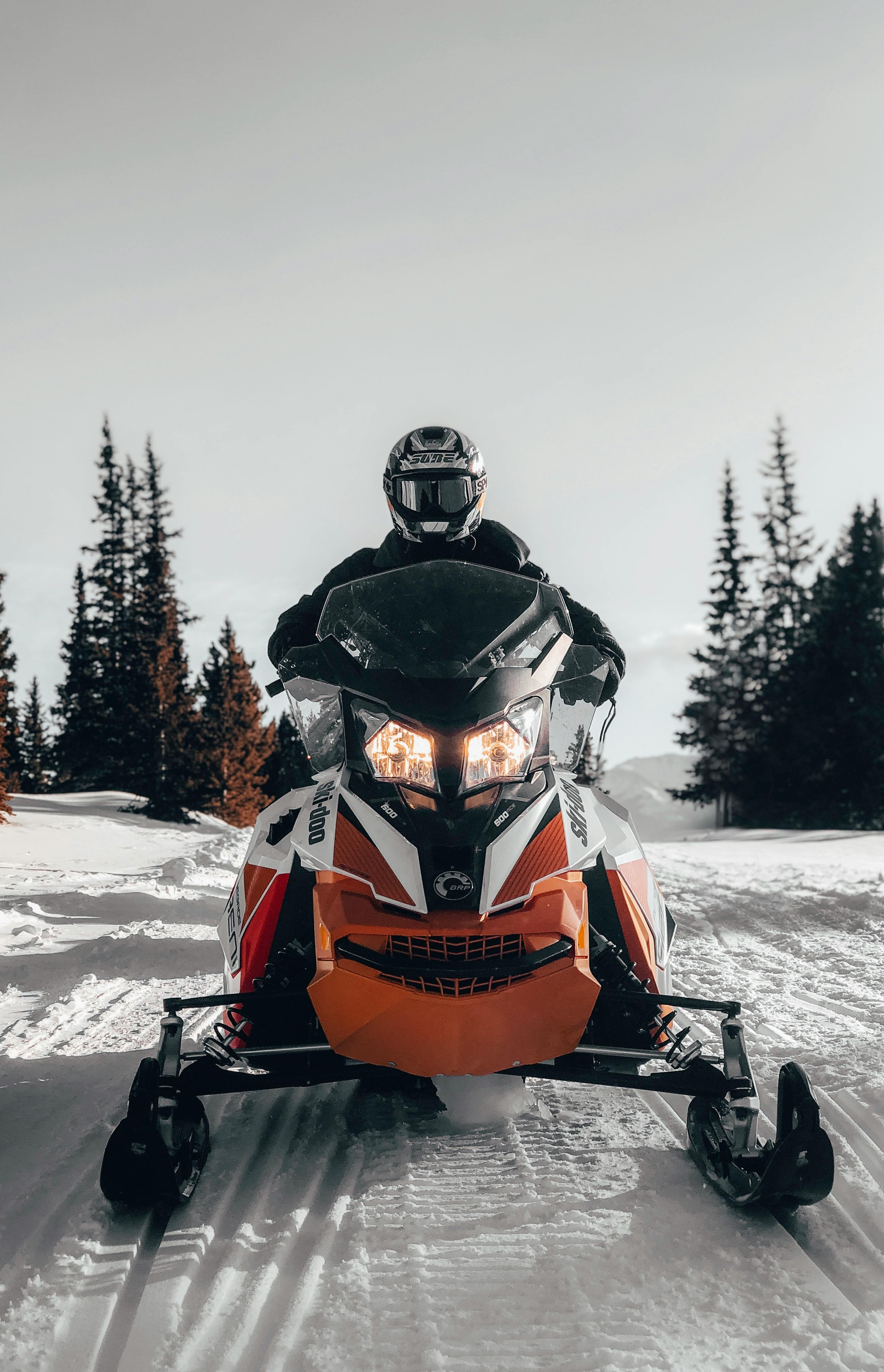 Photo of Person Riding Snowmobile · Free Stock Photo