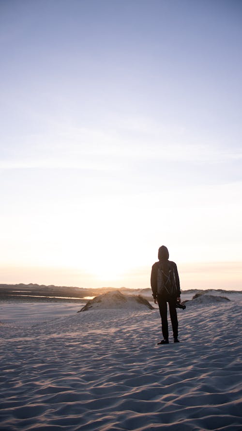 Free stock photo of guy standing in sand dunes