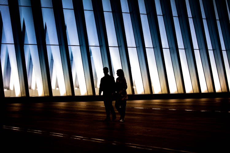 Silhouette Photography Of Man And Woman Walking